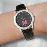 Elegant Minimalist Black Pink Monogram Watch<br><div class="desc">Personalized Monogram Black and White Watch with Simple White Numbers. This stylish, minimalist watch combines classic elegance with a personal touch, featuring a bold pink initial on a black face (note: the pink is a flat color without any shimmer), accented by simple white numbers for easy reading. The design includes...</div>