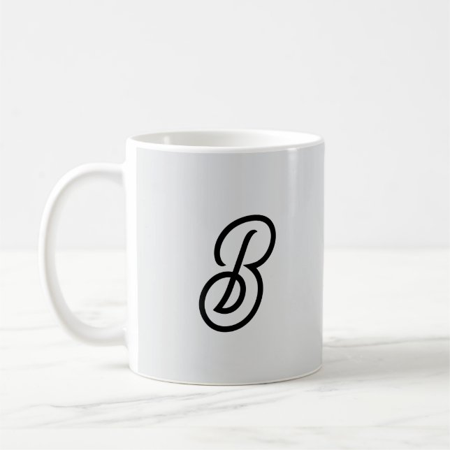 Elegant minimalist modern initial on gray coffee mug (Left)