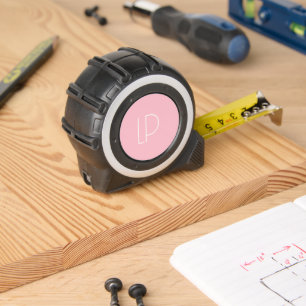 Elegant minimalist modern initial on pastel pink tape measure