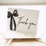 Elegant Modern Black Bow She's Tying the Knot Thank You Card<br><div class="desc">Express your gratitude in style with this Elegant Black Bow "She's Tying the Knot" Thank You Card. Featuring a sophisticated black bow design paired with chic typography, this card adds a touch of elegance to your bridal shower or wedding celebration. Perfect for thanking your guests, it’s a timeless and graceful...</div>