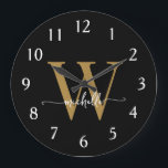 Elegant Modern Black Gold Monogram Name Script Large Clock<br><div class="desc">Girly Modern Elegant Stylish Black and Gold Monogram Initial Name Script Custom Personalized Large Clock. This design featuring a first name in a pretty hand lettered swash tail font calligraphy (or typography) with monogram initial in gold and white on black. Easy to customize it. Great stylish feminine housewarming gift, also...</div>