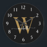 Elegant Modern Black Gold Monogram Name Script Large Clock<br><div class="desc">Girly Modern Elegant Stylish Black and Gold Monogram Initial Name Script Custom Personalized Large Clock. This design featuring a first name in a pretty hand lettered swash tail font calligraphy (or typography) with monogram initial in gold and white on black. Easy to customize it. Great stylish feminine housewarming gift, also...</div>