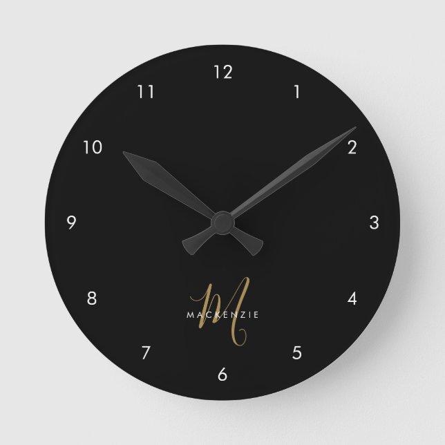 Elegant Modern Black Gold Script Monogram Round Clock (Front)