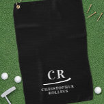 Elegant Modern Monogrammed Initials Name Black Golf Towel<br><div class="desc">Introducing our Black and White Minimalist Modern Monogram Golf Towel, the epitome of simplicity and sophistication. Embrace a modern aesthetic with this sleek design, featuring two initials and a first and last name separated by a simple, decorative slash. The typography stands out in elegant white against a striking black background,...</div>