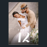 Elegant Modern Photo Wedding Reception Table Number<br><div class="desc">Elevate the ambiance of your celebration with our Elegant Modern Photo Wedding Reception table number cards, designed to guide your guests to their seats in style. Adorned with a beautiful photo of the happy couple, these cards allow you to showcase a cherished moment or favorite memory, adding a personal touch...</div>