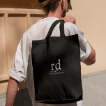 Elegant Monogram Black and White Groomsmen Gift  Tote Bag<br><div class="desc">Introducing the perfect gift for your groomsmen on your big day - an elegant and practical tote bag featuring black and white Classic Monogram Initials. This stylish accessory adds a touch of sophistication to any groomsmen tote bag and makes a thoughtful and practical gift for your wedding party. Crafted from...</div>