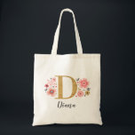 Elegant Monogram Name Initial Gold Pink Tote Bag<br><div class="desc">A beautiful,  feminine monogrammed pink floral tote bag featuring pink flowers and a faux gold monogram letter "D". Personalize the tote bag by adding your name underneath the monogram. Makes a fun gift for a friend or for a bridesmaid gift. Designed for you by Blackberry Boulevard.</div>