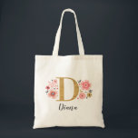 Elegant Monogram Name Initial Gold Pink Tote Bag<br><div class="desc">A beautiful,  feminine monogrammed pink floral tote bag featuring pink flowers and a faux gold monogram letter "D". Personalize the tote bag by adding your name underneath the monogram. Makes a fun gift for a friend or for a bridesmaid gift. Designed for you by Blackberry Boulevard.</div>