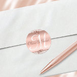 Elegant Monogram Wedding Rose Gold Classic Round Sticker<br><div class="desc">This elegant monogram wedding sticker has a rose gold background, edged with rose gold glitter damask and wedding rings. The monogram of the bride and groom is in the center in elegant script font. This could also be used for anniversaries or other events. **There is no actual rose gold, metallic...</div>