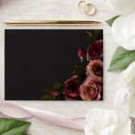 Elegant Moody Muted Rust & Burgundy Floral Wedding Envelope<br><div class="desc">Embrace timeless elegance for your gothic-inspired celebration with our captivating wedding invitation envelope. A soft black background provides the perfect canvas for a captivating, yet understated bouquet. Imagine a corner arrangement of muted rose blooms, where soft rust blush and rich burgundy hues mingle with dark green foliage. This ethereal design...</div>