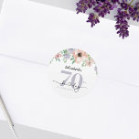 Elegant Pastel Floral 70th Birthday Party Classic Round Sticker<br><div class="desc">This elegant 70th birthday round sticker features soft pastel watercolor flowers across the top. The design combines modern typography with modern calligraphy,  creating a refined and stylish look—perfect for celebrating a special woman’s milestone birthday.</div>
