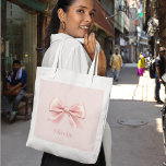 Elegant Pastel Pink Bow & Name Personalized Tote Bag<br><div class="desc">Carry your essentials in style with this elegant pastel pink tote bag, featuring a delicate bow design and your custom name. Perfect for daily use, shopping trips, or as a chic beach bag, this tote is both functional and fashionable. The high-quality material ensures durability, while the personalized design adds a...</div>