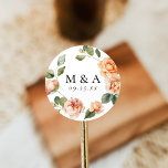 Elegant Peach Rose Monogram Wedding Classic Round Sticker<br><div class="desc">Introducing our Elegant Watercolor Peach Rose wedding stickers, the perfect way to add a touch of elegance to every aspect of your wedding. Featuring the couple's monogram initials and wedding date encircled by a wreath of peach roses and green leaves, these stickers are as versatile as they are beautiful. Use...</div>