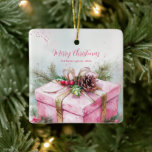 Elegant Pink Vintage Christmas Ceramic Ornament<br><div class="desc">This vintage Christmas ornament features a nostalgic watercolor painting of a beautifully wrapped pink package with old-fashioned gold ribbons, pink and red holly berries, seasonal green fir accents and pine cones. It is an elegant nostalgic and romantic image of a lovely Yuletide present for a loved one. All of the...</div>