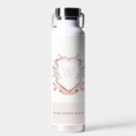 Elegant Pink Wildflower Watercolor Crest Monogram Water Bottle<br><div class="desc">Pastel Wildflower watercolor Collection- it's an elegant watercolor Illustration of pink blush watercolor delicate wildflowers with a modern minimal touch. Perfect for your modern floral wedding & parties. It’s very easy to customize,  with your personal details. If you need any other matching product or customization,  kindly message via Zazzle.</div>