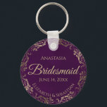 Elegant Plum Purple & Gold Bridesmaid Wedding Gift Keychain<br><div class="desc">These keychains are designed to give as favors to bridesmaids in your wedding party. They feature a simple yet elegant design with a deep plum purple colored background, gold script lettering, and a lacy golden faux foil floral border. The text says "Bridesmaid" with space for her name, the names of...</div>