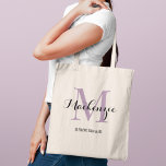 Elegant Purple Custom Wedding Bridesmaid Name Tote Bag<br><div class="desc">Elegant custom wedding tote bag features a personalized monogram typography design with modern calligraphy script name and serif monogram initial in lavender purple and black colors. Includes custom text for a bridal party title like "BRIDESMAID" or other preferred wording.</div>