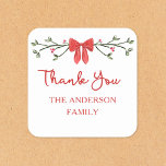 Elegant Red Bow Personalized Christmas Thank You Square Sticker<br><div class="desc">Add a touch of holiday cheer to your gratitude with this elegant Christmas thank-you stickers. Featuring a festive red bow and delicate greenery design, these customizable stickers is perfect for expressing heartfelt thanks during the holiday season. The classic design pairs beautifully with any holiday theme, making it perfect for spreading...</div>
