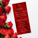 Elegant Red Silk Wedding Rings Program<br><div class="desc">This elegant wedding program features a lush, rippling red silk background with a pair of golden wedding rings. The design is both timeless and modern, and it will complement any wedding style. The program is printed on high-quality cardstock and features a luxurious feel. The text is easy to read, and...</div>