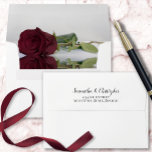 Elegant Reflecting Burgundy Rose Wedding Envelope<br><div class="desc">These beautiful wedding envelopes are perfect for making your invitations all the more special. They feature a romantic design on the inside flap with a single long-stemmed burgundy, maroon, or wine-red colored rose reflecting with waves and ripples. The back flap has your return address in lacy script calligraphy. Sophisticated and...</div>
