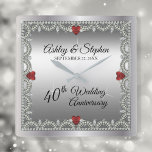 Elegant Ruby | Diamonds 40th Wedding Anniversary Square Wall Clock<br><div class="desc">Opulent elegance frames this 40th wedding anniversary design in a unique scalloped diamond design with center teardrop diamond with heart-shaped ruby accents and faux added sparkles on a silver-tone gradient. Please note that all embellishments are printed and are only made to appear as real as possible in a flat, printed...</div>