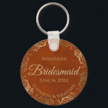 Elegant Rust Orange & Gold Bridesmaid Wedding Gift Keychain<br><div class="desc">These keychains are designed to give as favors to bridesmaids in your wedding party. They feature a simple yet elegant design with a rust orange or burnt umber colored background, gold script lettering, and a lacy golden faux foil floral border. The text says "Bridesmaid" with space for her name, the...</div>