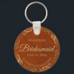 Elegant Rust Orange & Gold Bridesmaid Wedding Gift Keychain<br><div class="desc">These keychains are designed to give as favors to bridesmaids in your wedding party. They feature a simple yet elegant design with a rust orange or burnt umber colored background, gold script lettering, and a lacy golden faux foil floral border. The text says "Bridesmaid" with space for her name, the...</div>