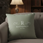 Elegant Sage Monogram Throw Pillow<br><div class="desc">Bring warmth and elegance to your home with this customizable sage green throw pillow. Easily personalize with your monogram, family name, and est. date, making it a meaningful accent for your living room, bedroom, or entryway. The soft sage green backdrop offers a soothing, contemporary feel that complements a variety of...</div>