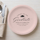 Elegant Script Blush Pink Cheers to the Graduate Paper Plates<br><div class="desc">Elegant graduation paper plates featuring a graduation cap with the phrase "Cheers to the Graduate" in a black calligraphy script on a blush pink background. Personalize the modern graduation paper plates with the graduate's name, school name, and graduation year. The simple graduation plates are perfect to use for your high...</div>