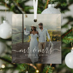 Elegant Script & Custom Newlyweds Photo Christmas Glass Ornament<br><div class="desc">Commemorate your new union as Mr. & Mrs. with an exquisite Christmas keepsake glass ornament. Featuring a cherished photo of the happy couple,  elegant white calligraphy script,  and the newlyweds' names and year of marriage,  this design is the perfect addition to your holiday decor.</div>