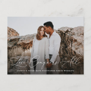 Elegant Script Love Conquers All Postponement Announcement Postcard