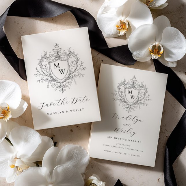 Elegant script monogram crest  save the date (Creator Uploaded)