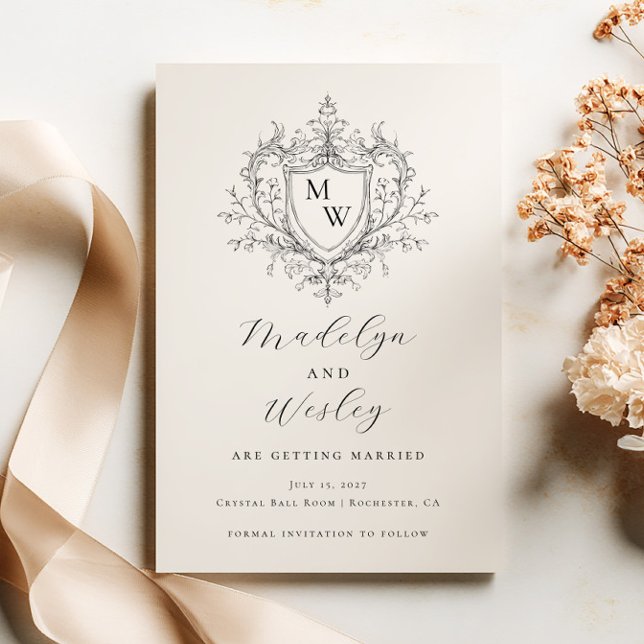 Elegant script monogram crest  save the date (Creator Uploaded)