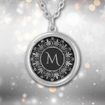 Elegant Silver Leaf Border Monogram Silver Plated Necklace<br><div class="desc">This elegant necklace features your monogram in silver on a dramatic black background. The monogram is framed by a circular design using leaf and swirl images repeated around the perimeter. Beautiful!</div>