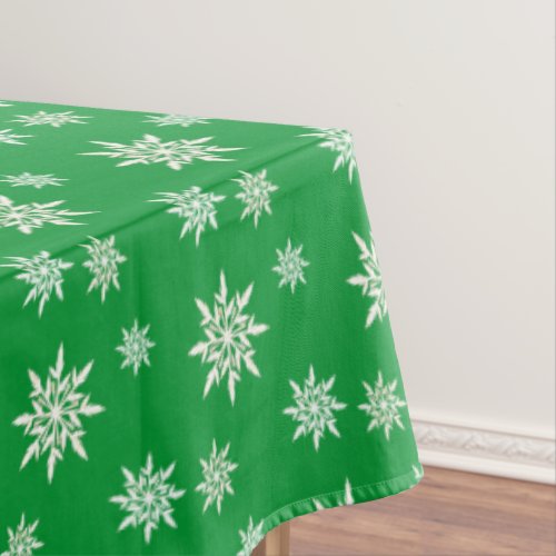 Elegant snowflakes on green tablecloth