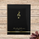 Elegant Treble Clef Music 2025 Yearly Planner<br><div class="desc">This simple and elegant black yearly planner features a treble clef in faux gold. Perfect for music teachers,  music school offices,  musicians,  music lovers and more. Customize it with your own details and utilize the editing tool to make further adjustments,  such as font size and placement.</div>