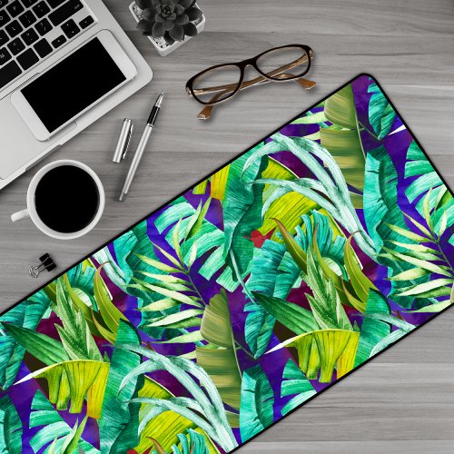Elegant tropical green leaves purple pattern desk mat