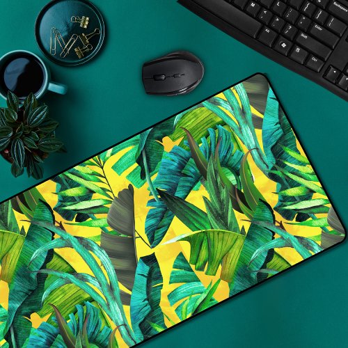 Elegant tropical green leaves yellow pattern desk mat