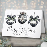 Elegant Watercolor Simple Black White Christmas Holiday Card<br><div class="desc">Send warm holiday wishes with this elegant Christmas card, featuring a minimalist design of three black and white watercolor ornaments on the front, accented by evergreen greenery and cute bow details. "Merry Christmas" is written in graceful script typography, with your family name displayed below in a classic serif font for...</div>