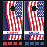 Elegant Wavy American Flag with Personalized Name  Cornhole Set<br><div class="desc">Celebrate the stars and stripes in elegant style with this flowing wavy US flag design on a deep blue background. The graceful curve of the flag stretches down the length of the board, bringing a refined patriotic look to your outdoor games. A customizable white name band bordered in navy blue...</div>