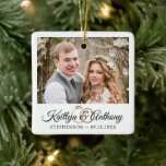 Elegant Wedding Rings 2 Photo Commemorative White Ceramic Ornament<br><div class="desc">Create an elegant commemorative white wedding keepsake ornament featuring one or two photos, an elegant calligraphy script font for the couple's names accented with wedding rings and their wedding date. Makes a meaningful wedding or holiday gift for the newlyweds or create one to commemorate your First Christmas as Mr. and...</div>