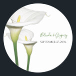 Elegant White Calla Lilies Wedding  Classic Round Sticker<br><div class="desc">This elegant floral design features white calla lilies. The beautiful white calla lilies are complete with their green stems. The bride's and groom's names are color matched to the green stems of the calla lily flower. This is the perfect elegant floral wedding design ideal for any wedding theme. Elegant calla...</div>