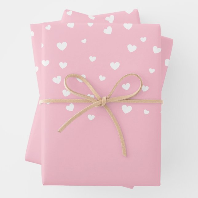 Elegant White Hearts on Pastel Pink Wrapping Paper Sheets (In situ)