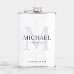 Elegant White Personalized Groomsmen Flask<br><div class="desc">Add a personal touch to your wedding with personalized groomsmen flask.
This flask features personalized groomsman's name with title and wedding date in grey and monogram in light grey as background,  in classic serif font style,  on white background.

Also perfect for best man,  father of the bride and more.</div>