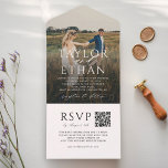 Elegant White QR Code Photo Wedding All In One Invitation<br><div class="desc">Elegant all in one photo wedding invitation featuring white calligraphy script and serif typography overlaid on a full-bleed engagement photo, with event details flowing beneath. The lower panel includes a QR code for guests to RSVP and access your wedding website — no tear-off response card needed. The back features "Kindly...</div>