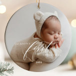 Elegant White Script Baby's First Christmas Photo  Ceramic Ornament<br><div class="desc">Celebrate your baby's first Christmas with this elegant and timeless photo ornament, featuring the text "Baby's First Christmas" where you can add a custom name. With it's classic design this keepsake will hold cherished memories for years to come. Perfect as a gift for new parents or to add a special...</div>