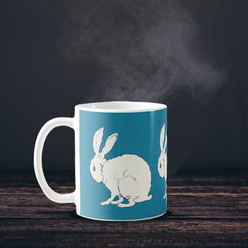 elegant white sitting bunny rabbits on blue  coffee mug