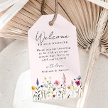 Elegant Wildflower Meadow Blush Wedding Welcome Gift Tags<br><div class="desc">Elegant floral wedding welcome gift tags featuring a bottom border of watercolor wildflowers and foliage in shades of pink, yellow, purple, blue, and green on a blush pink background. Personalize the wildflower tags with a short welcome message, your names, or custom text. The wildflower wedding gift tags are perfect for...</div>