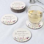 Elegant Wildflower Meadow Cream Bridal Shower Round Paper Coaster<br><div class="desc">Elegant floral bridal shower paper coasters featuring a bottom border of watercolor wildflowers and foliage in shades of pink, yellow, purple, blue, and green on a cream background. Personalize the wildflower bridal shower coasters with the bride-to-be's name and the date. The personalized wildflower coasters are perfect for spring and summer...</div>