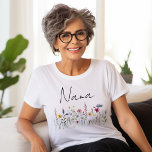 Elegant Wildflower Meadow Nana Baby Shower T-Shirt<br><div class="desc">Celebrate being a grandma-to-be with this Elegant Wildflower Meadow Nana baby shower t-shirt. The shirt displays "Nana" in a handwritten black script with a whimsical array of wildflowers in beautiful hues of pink, yellow, purple, blue, and green. The watercolor wildflower Nana t-shirt is perfect to wear at spring and summer...</div>